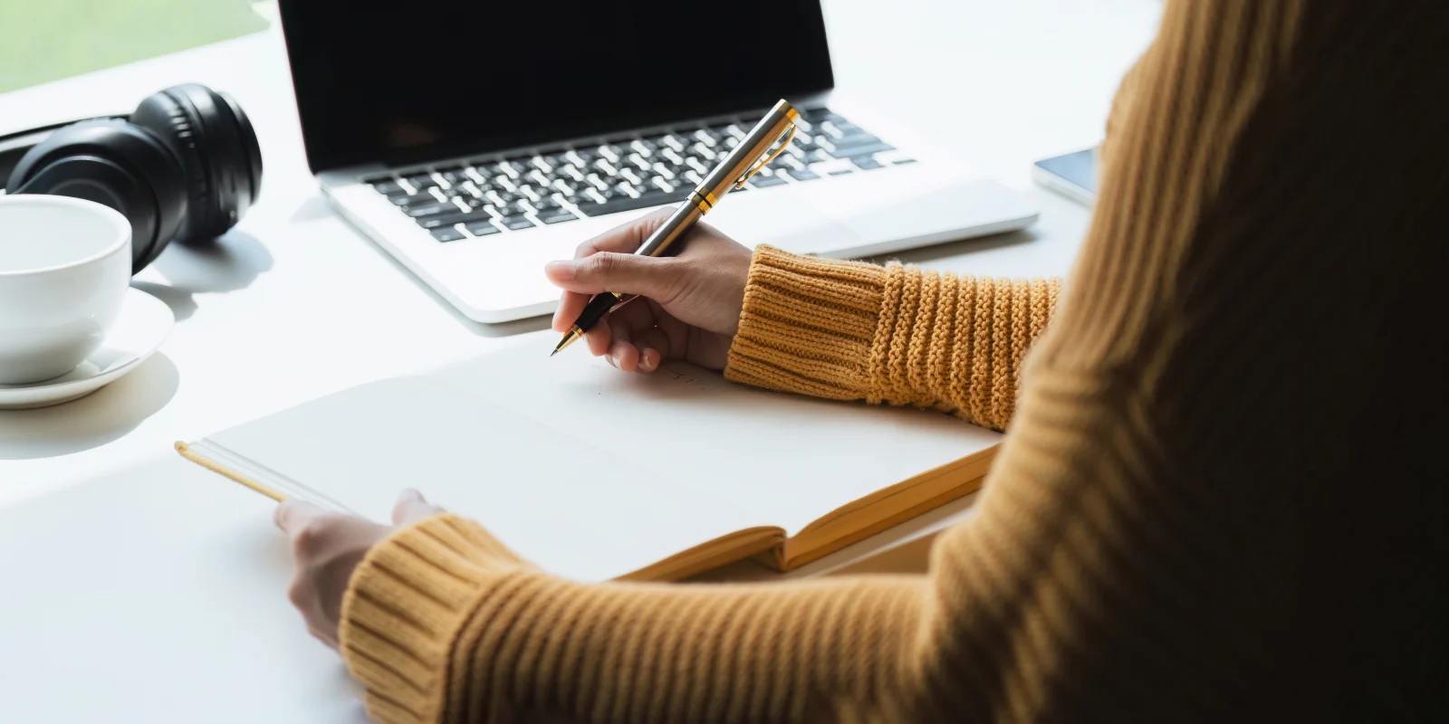 Person writing in a notebook – online psychiatry in Hobbs, NM